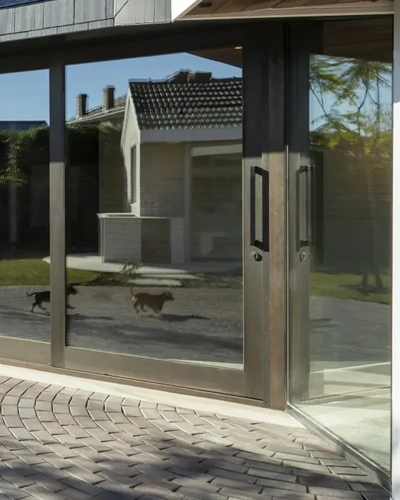 Example photo: tall glass doors on a modern home