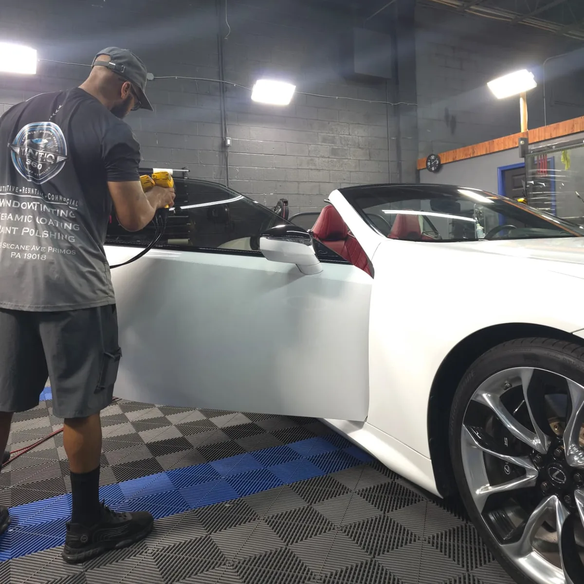 Jay heat-shrinking window film on a white Lexus LC convertible in the Tint IQ 360 shop